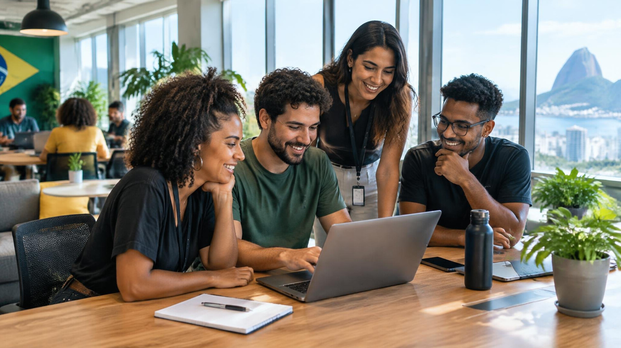 People collaborating with laptops in a modern space