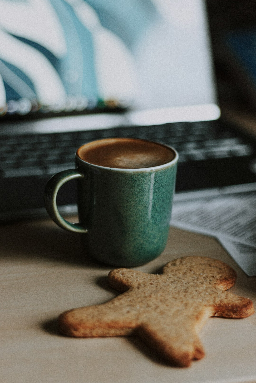 Desk with laptop, notebook and coffee cup